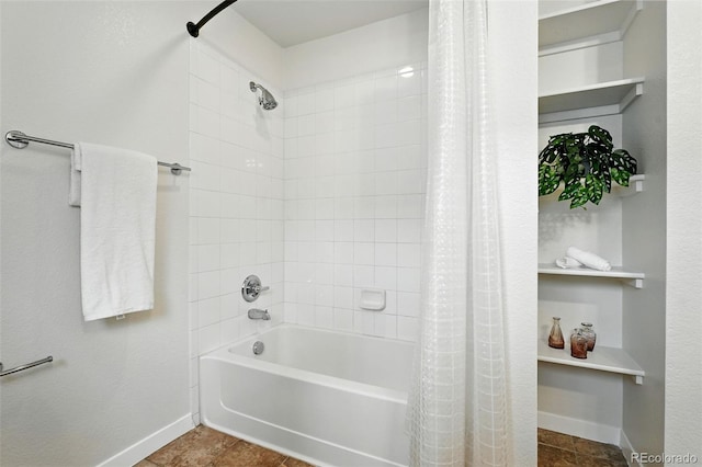 2518 16th St, Denver, CO 80211 - bathroom featuring shower / bath combo with shower curtain, baseboards, and tile patterned flooring