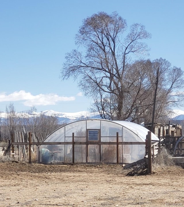 view of outdoor structure featuring a mountain view