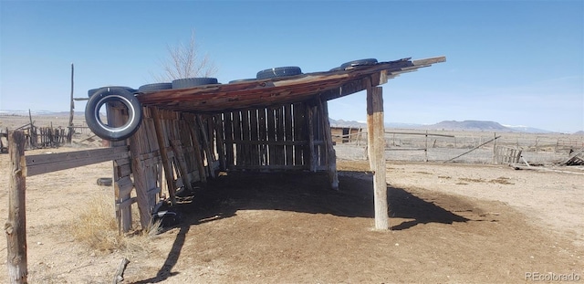 exterior space featuring a rural view and a mountain view