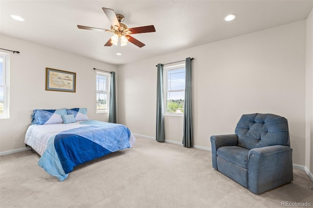 carpeted bedroom with ceiling fan