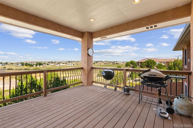 wooden deck with grilling area