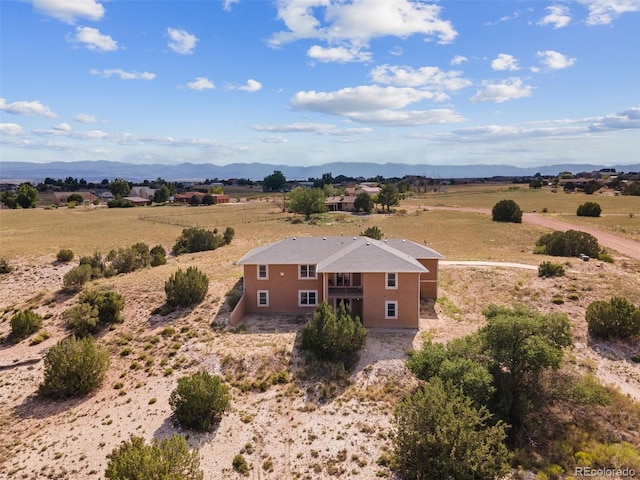 bird's eye view featuring a rural view and a mountain view