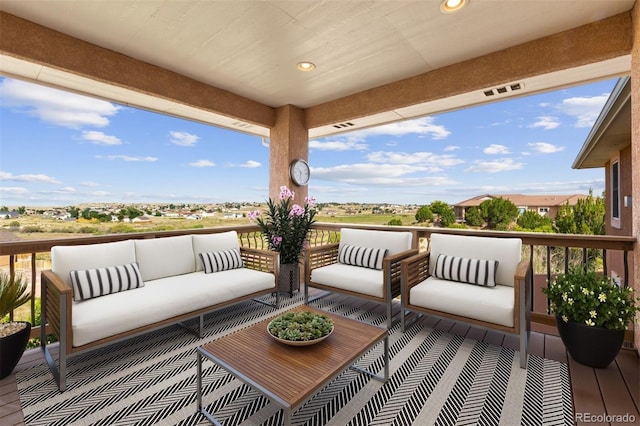 wooden deck featuring outdoor lounge area