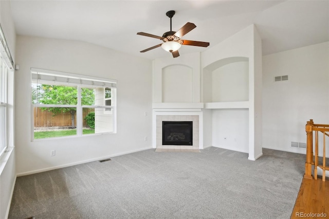 11847 Trail View Ln, Parker, CO 80134 - unfurnished living room with ceiling fan, a tiled fireplace, and carpet