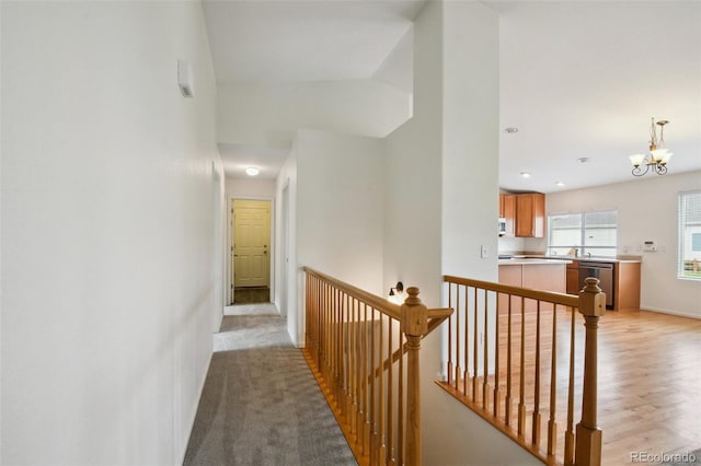 11847 Trail View Ln, Parker, CO 80134 - hall with an upstairs landing, a chandelier, light wood-style floors, and recessed lighting