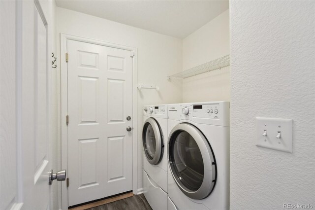 11847 Trail View Ln, Parker, CO 80134 - laundry room with washing machine and clothes dryer and dark wood-type flooring