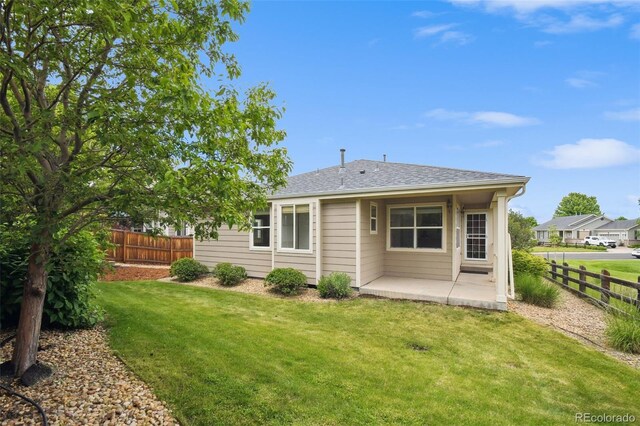 11847 Trail View Ln, Parker, CO 80134 - rear view of house featuring a patio area and a shingled roof