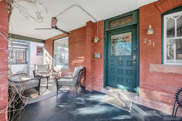 entrance to property with ceiling fan