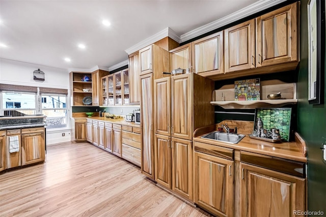 kitchen featuring sink and light wood-type flooring