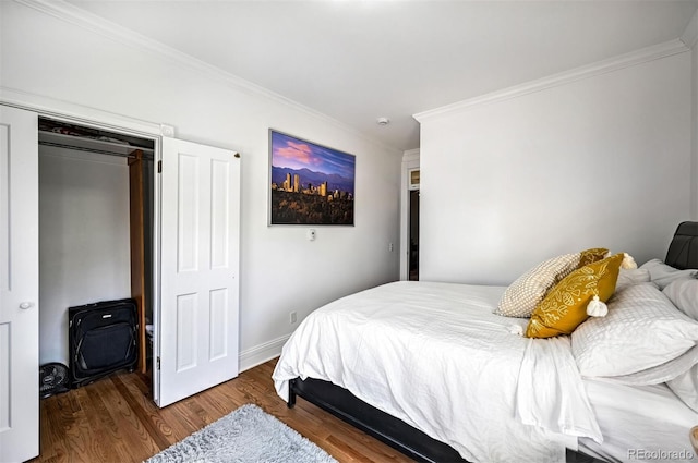 bedroom with crown molding and dark wood-type flooring