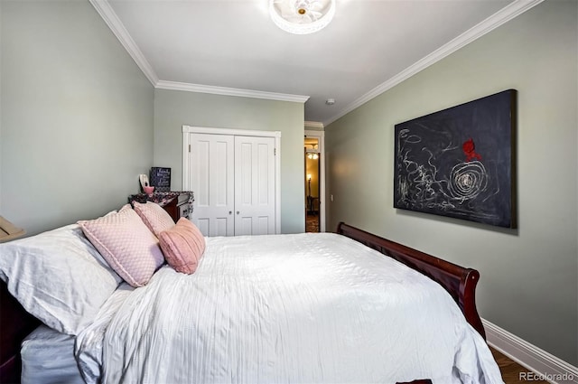 bedroom with ornamental molding, wood-type flooring, and a closet