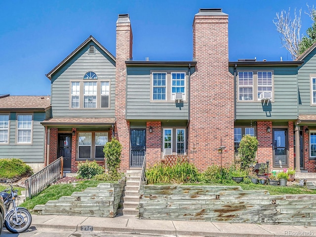 17427 E Rice Cir Unit C, Aurora, CO 80015 - townhome / multi-family property with a chimney and brick siding