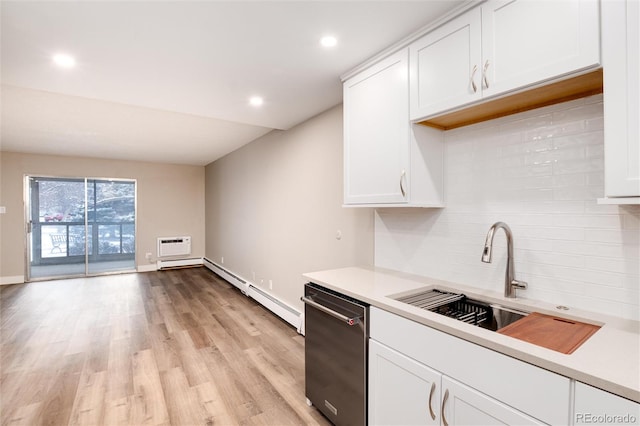 kitchen featuring sink, white cabinets, and light hardwood / wood-style flooring