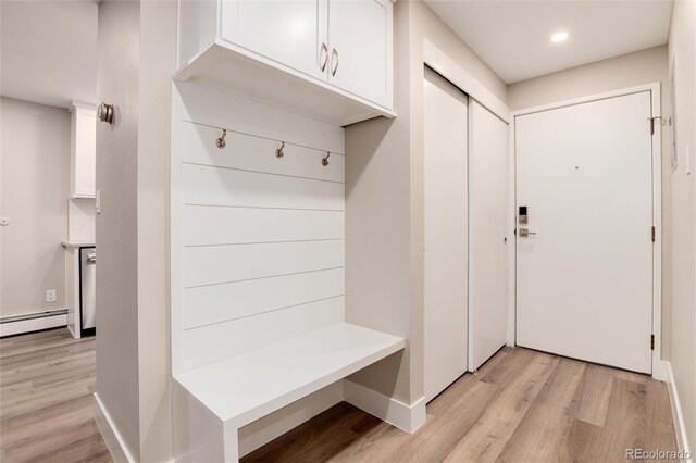 mudroom with a baseboard radiator and light hardwood / wood-style flooring