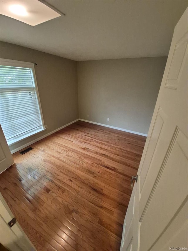 1962 S Ivory Way, Aurora, CO 80013 - spare room with light wood-style flooring and baseboards
