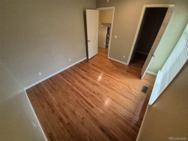 1962 S Ivory Way, Aurora, CO 80013 - unfurnished bedroom with light wood-style flooring and baseboards