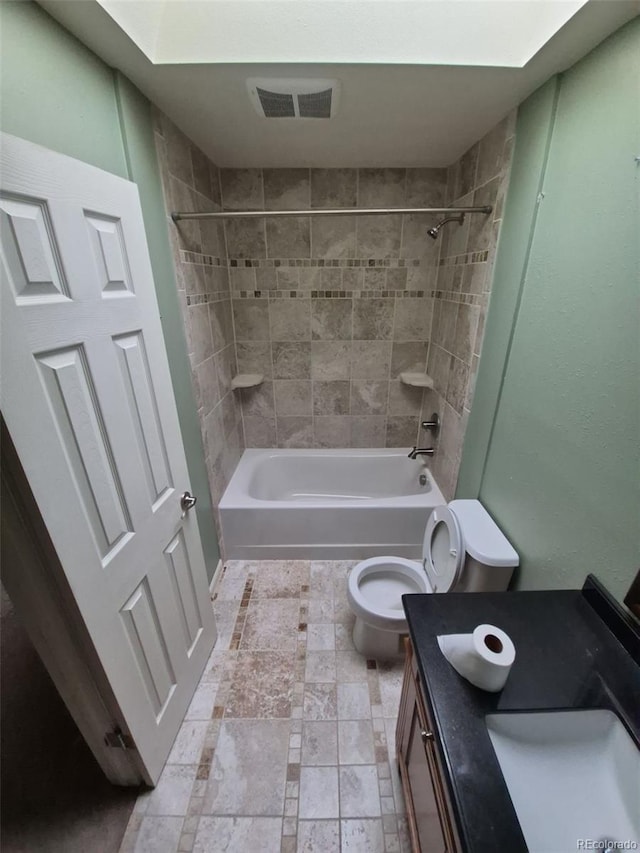 1962 S Ivory Way, Aurora, CO 80013 - full bathroom featuring vanity, toilet, and shower / washtub combination