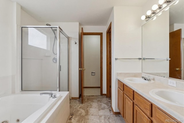 full bath with a shower stall, a whirlpool tub, double vanity, and a sink