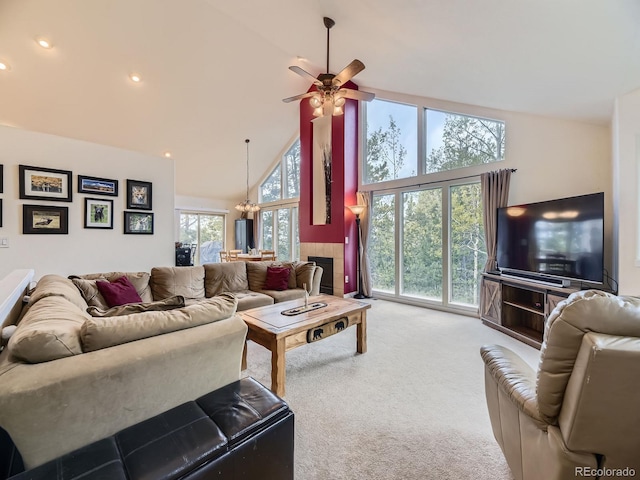 11526 Green Cir, Conifer, CO 80433 - living room with high vaulted ceiling, carpet flooring, a ceiling fan, a chandelier, and recessed lighting