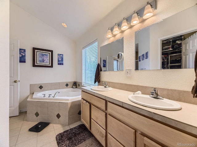 11526 Green Cir, Conifer, CO 80433 - bathroom featuring tile patterned floors, a garden tub, double vanity, and lofted ceiling