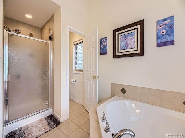 11526 Green Cir, Conifer, CO 80433 - full bathroom with a stall shower, tile patterned floors, and a garden tub