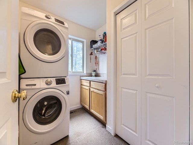 11526 Green Cir, Conifer, CO 80433 - washroom featuring stacked washer / dryer and carpet