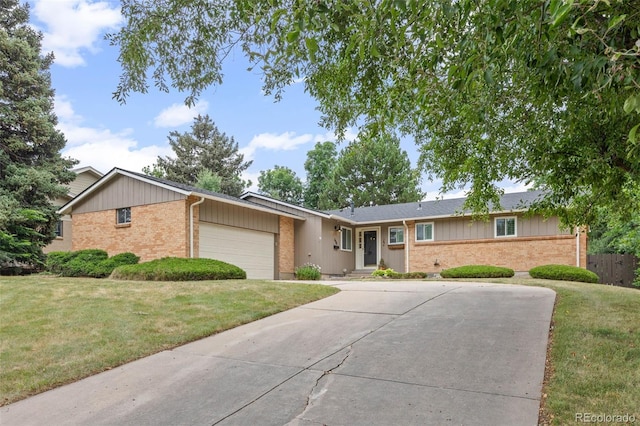 888 E Davies Ave, Centennial, CO 80122 - ranch-style house featuring brick siding, a garage, and driveway