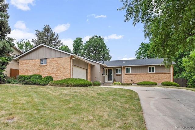 888 E Davies Ave, Centennial, CO 80122 - single story home with brick siding, a garage, and concrete driveway