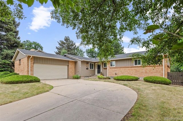 888 E Davies Ave, Centennial, CO 80122 - single story home with brick siding, concrete driveway, an attached garage, and roof with shingles