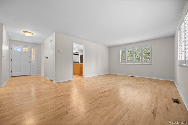 888 E Davies Ave, Centennial, CO 80122 - foyer with light wood-style flooring and baseboards