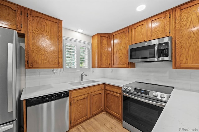 888 E Davies Ave, Centennial, CO 80122 - kitchen with appliances with stainless steel finishes, light countertops, tasteful backsplash, and recessed lighting