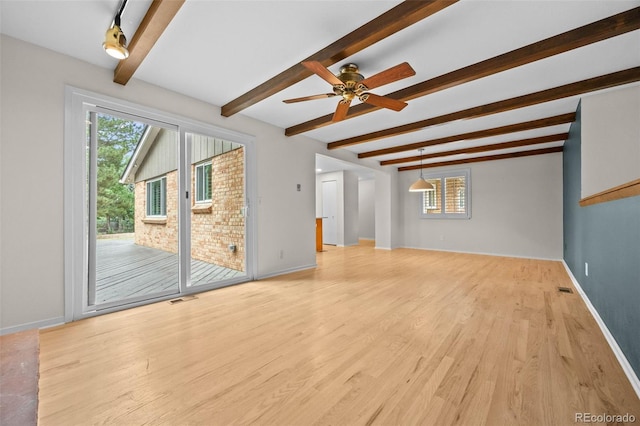 888 E Davies Ave, Centennial, CO 80122 - unfurnished living room featuring beam ceiling, plenty of natural light, light wood-style floors, and a ceiling fan