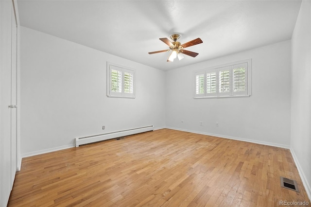 888 E Davies Ave, Centennial, CO 80122 - empty room featuring a baseboard radiator, light wood-style floors, and ceiling fan