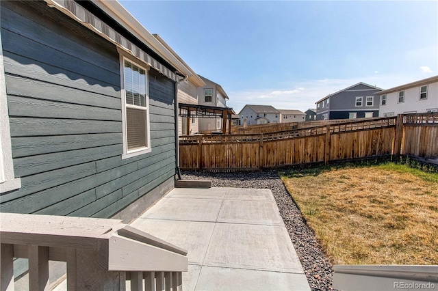 view of yard featuring fence and a patio area