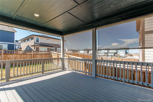 deck featuring a residential view and a fenced backyard