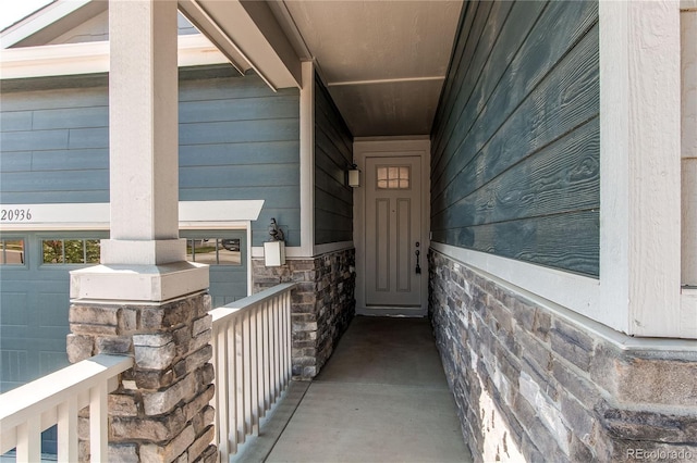 view of exterior entry with stone siding
