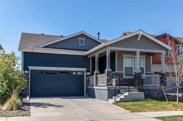 craftsman-style house featuring a garage, stone siding, roof with shingles, concrete driveway, and a porch