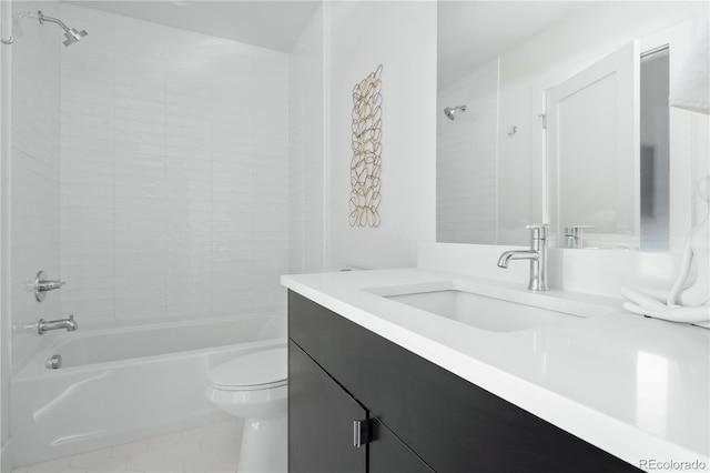 full bathroom with tiled shower / bath, vanity, tile patterned floors, and toilet