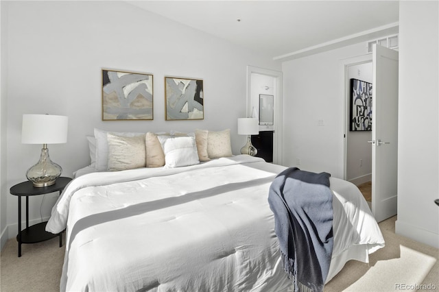 bedroom featuring light colored carpet