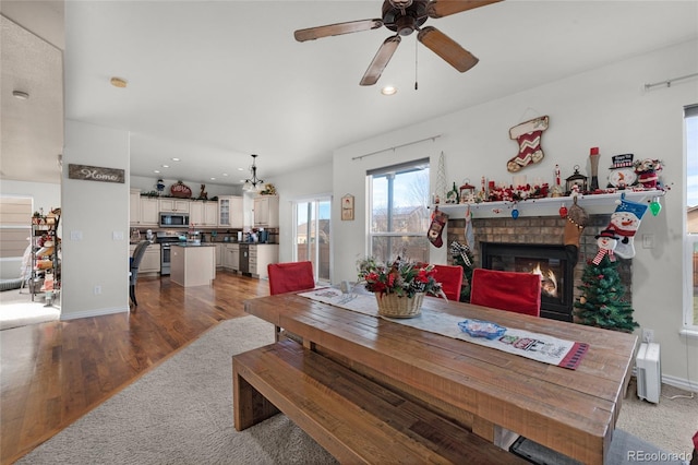 dining room with wood-type flooring and ceiling fan