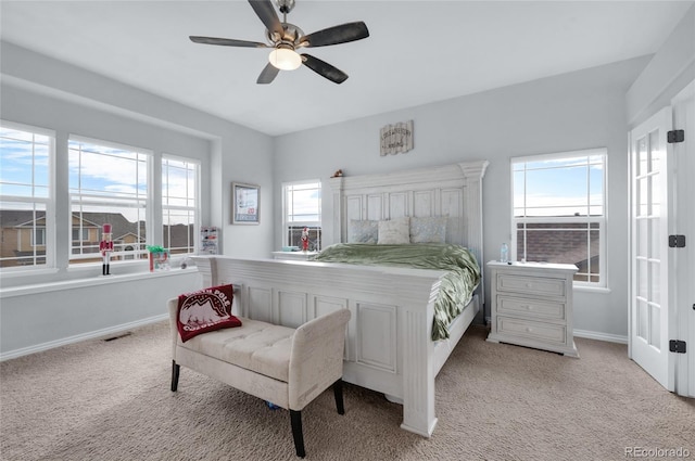 bedroom with light carpet and ceiling fan