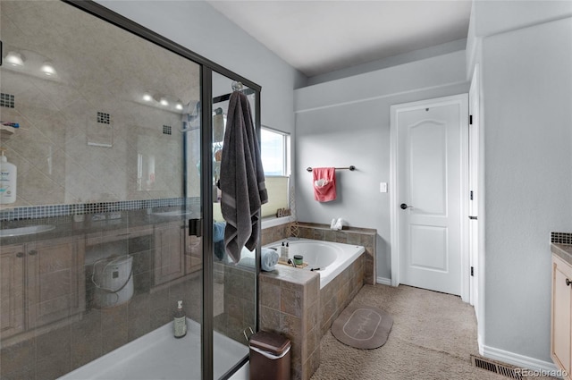 bathroom with vanity and plus walk in shower