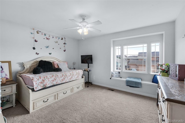 carpeted bedroom featuring ceiling fan