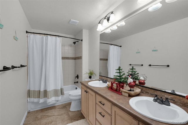 full bathroom featuring vanity, shower / bath combination with curtain, and toilet