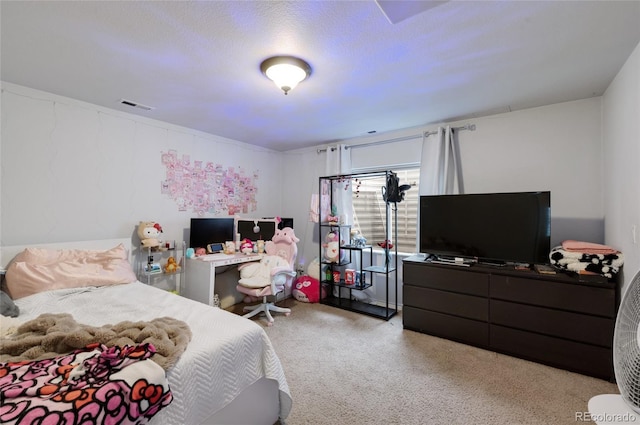 bedroom featuring light colored carpet and a textured ceiling