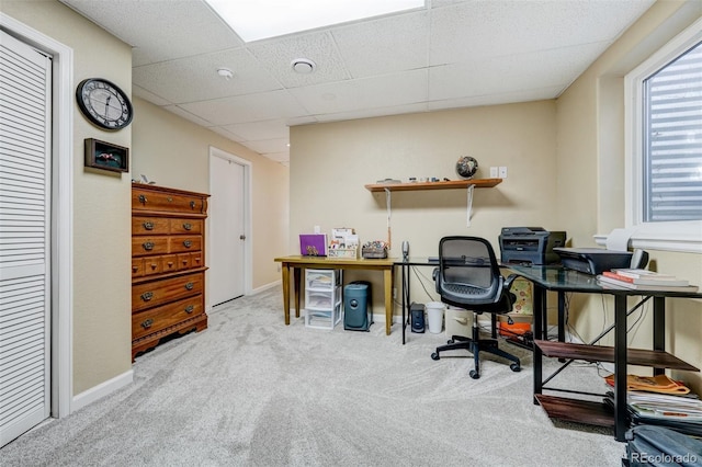 office space with light colored carpet and a drop ceiling