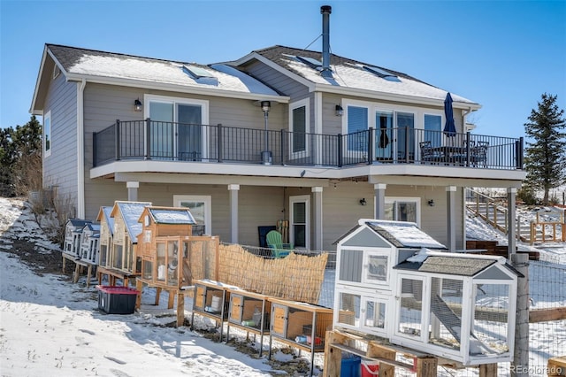 view of front of home with a balcony