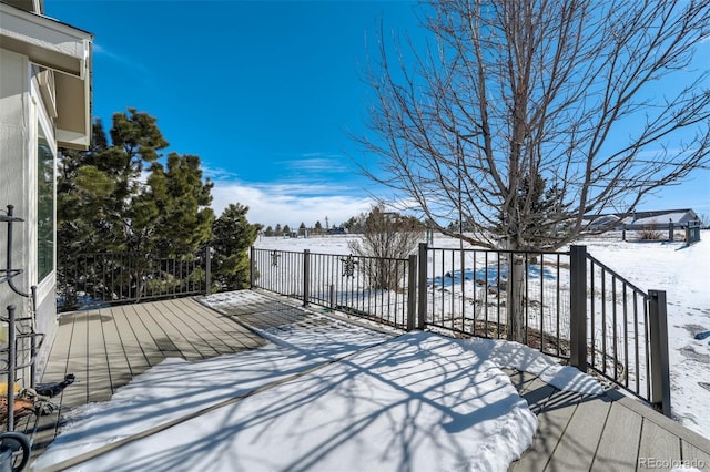 view of snow covered deck