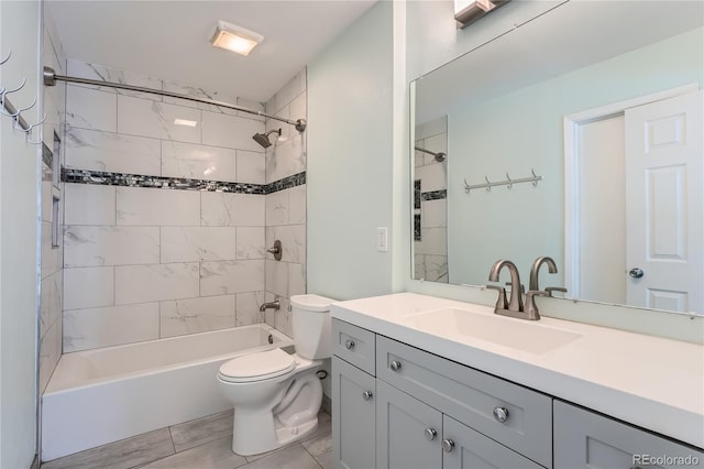 bathroom featuring toilet, vanity, and bathing tub / shower combination