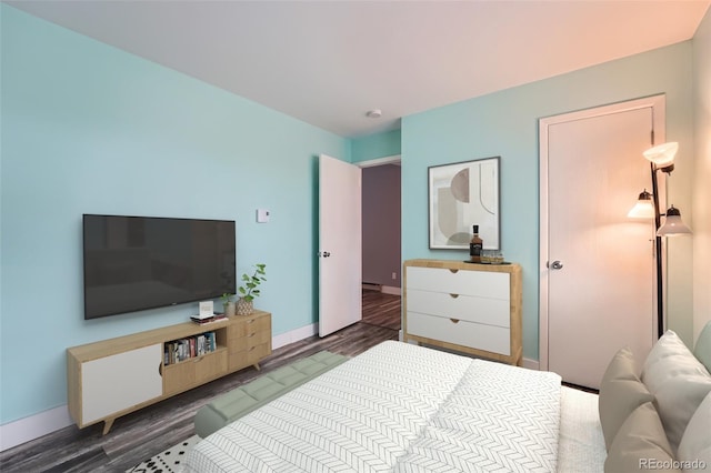 bedroom with dark wood-style floors and baseboards